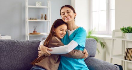 caregiver hugging child