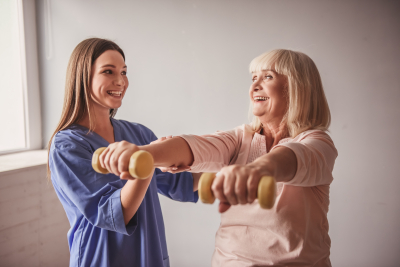 nurse helping senior exercise