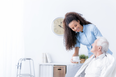 female nurse with senior on a wheelchair