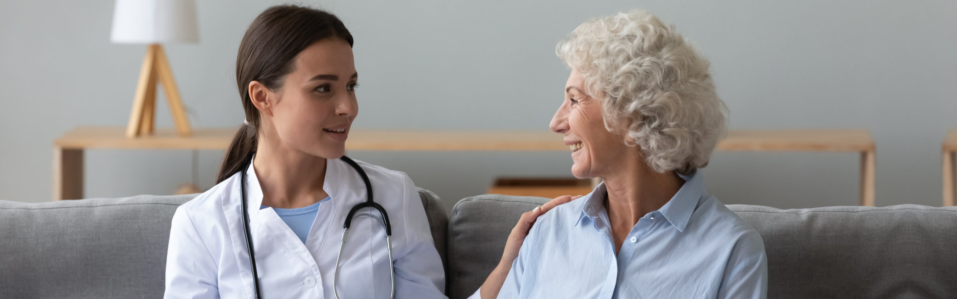 caregiver checking senior woman