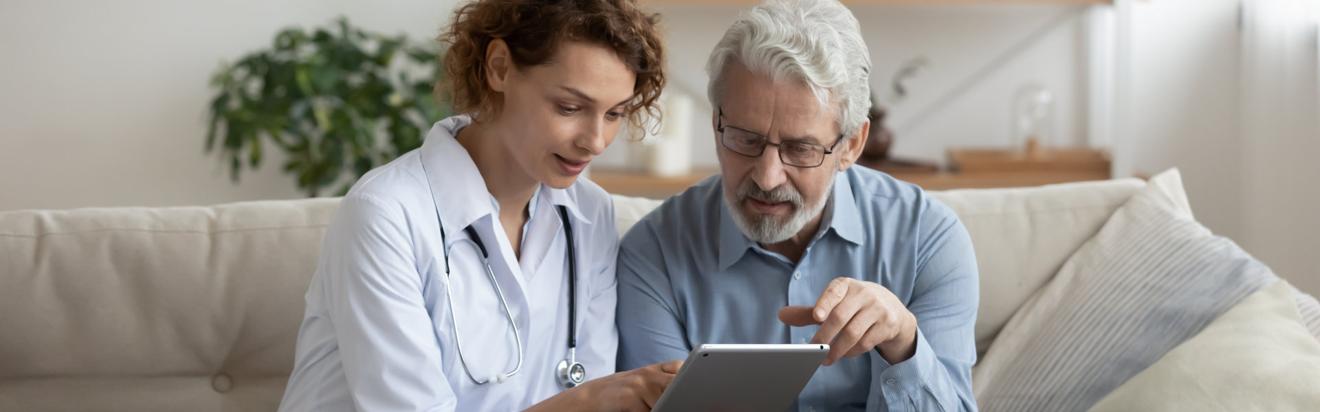 caregiver helping senior man